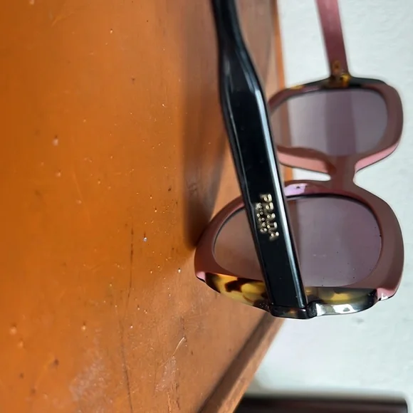 Prada sunglasses. Gently worn. No scratches.comes with case. - Picture 3 of 4